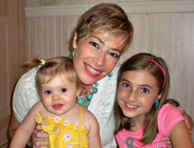 Cheryl Bennett of East Hampton, the mother of Sophia, 1, and Jenna, 9, is experiencing financial difficulties while being treated for breast cancer.