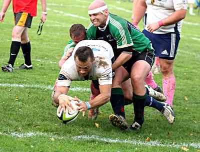 Gordon Trotter, about to touch the ball down in Bayonne’s try zone above, and his teammates overwhelmed the side from Jersey Saturday.