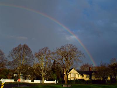 Tuesday’s clearing sky briefly lit up with a rainbow, seen over the Baker House inn in East Hampton Village.