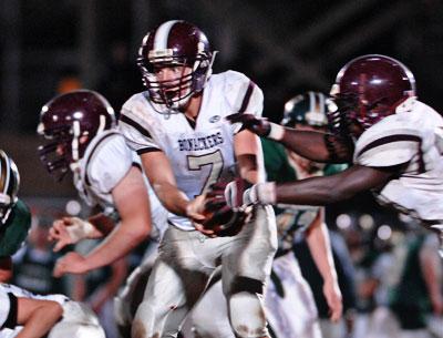 Cort Henevgeld, handing off to Andre Cherrington, above, gained 231 yards himself.