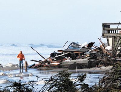 Only twisted debris remained Tuesday at one of Ronald Lauder’s Wainscott houses. The white bags had been placed to stave off ongoing erosion.