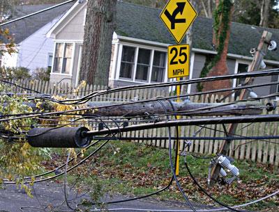 Toppled utility poles were common, knocking out electricity and, in some cases, telephone service, to thousands of people.