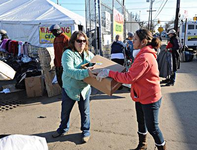 Dorine Drohan, left, and Marilyn Torres of East End Cares unloaded donated goods at St. Francis de Sales Catholic Church in Belle Harbor in the Rockaways on Sunday.