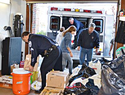 Sag Harbor Police Chief Tom Fabiano, right, helped load an ambulance with supplies collected from the community, and drove along with Ed Downes, president of Sag Harbor’s volunteer ambulance corps, to donate the ambulance to the Broad Channel Fire Department in Jamaica Bay, which lost its entire fleet.