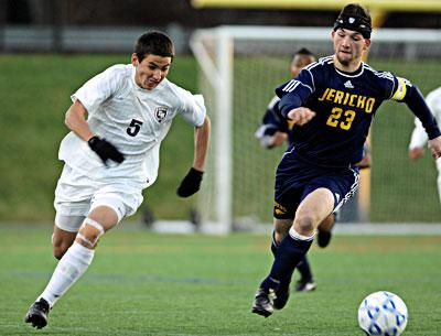 Nick West (5), who led East Hampton in scoring in the postseason, and his teammates were held in check by the Jayhawks.