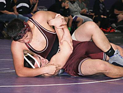 Axel Alanis, East Hampton’s 170-pounder, is only a freshman, but looked very good Saturday. Versus a Sayville senior, above, he almost erased a large deficit when he clamped on a headlock in the third period.