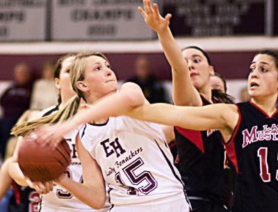 Carley Seekamp, with the ball, was a great help on the boards and also chipped in with 8 points here Friday night.