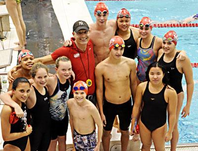 The Hurricanes had 12 finalists at Eisenhower Park, among them, from left, Liana Paradiso, Chasen Dubs, Cecelia de Havenon, Maggie Purcell, Ryan Duryea, Alex Astilean, Noelle Capone, and, at the rear with Tom Cohill, the coach, Thomas Brierley, Skye Marigold, Lilah Minetree, and Georgie Bogetti. Another finalist, Marikate Ryan, is not in the photo.