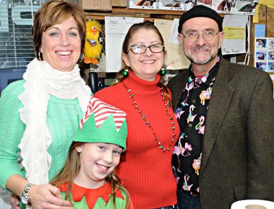 One Stop Pet Shop in Amagansett held its annual Santa Paws event on Sunday. Pictured from left are the shop’s Suzanne Bye, Haleigh, her daughter, Lisa Narizzano, and Mario Orlando.