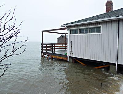 For the second time in two months, an extremely high tide in Gardiner’s Bay surrounded a house off Mulford Lane at Lazy Point, where the East Hampton Town Zoning Board of Appeals recently approved a revetment.