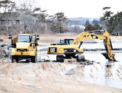 Workers excavated sand from Georgica Pond this week. Patrick Bistrian’s company has been granted sole access to the East Hampton Town Trustees’ 12,000-cubic-yard allotment.