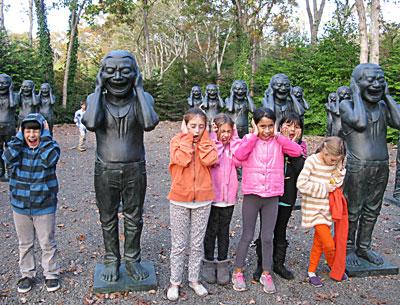 On a visit to the LongHouse Reserve in East Hampton this fall, young members of a nature club sponsored by Third House Nature Center posed with sculptures by Yue Min Jun.