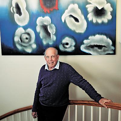 Mickey Straus at home with an art collection that features South Fork artists such as April Gornik, Jennifer Bartlett, and Ross Bleckner. (On the wall above is one of Mr. Bleckner’s paintings.)