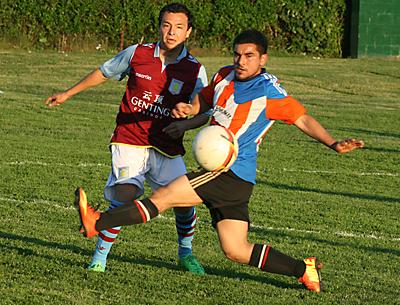 Marco Bautista, at right, one of the Hideaway’s stalwarts, contended for the ball with one of the Maidstone Market’s defenders, Antonio Padilla, in the second half of a game on June 12 that the Hideaway won 3-1.