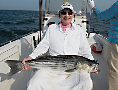 Ernie Baltz, visiting from Canada, went fishing with Ken Rafferty, a light-tackle and fly-fishing guide, on June 26 and caught this 20-pound striper near Little Gull Island on his first cast.