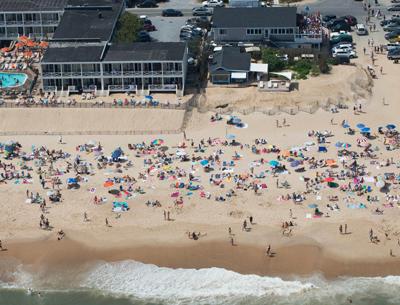 An extra-long holiday weekend and sunny skies brought happy crowds to the beaches at South Edison in Montauk, above, and all over the South Fork.