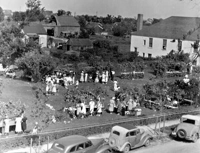 The Amagansett Presbyterian Church summer fair as seen from a high perch in 1939. The church will hold its 100th annual fair on Saturday.