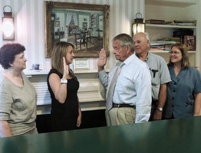 Becky Molinaro was sworn in as administrator of the Village of East Hampton by Mayor Paul F. Rickenbach Jr. on Monday at Village Hall. Witnessing the swearing in were Barbara Borsack and Bruce Siska of the village board and Pam Bennett, deputy clerk.