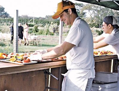 Outstanding in the Field, a California outfit that hosts farm-to-table dinners at outdoor spots around the country, stopped in at the East End Community Organic Farm in East Hampton on Sept. 10, where Jason Weiner, left, of Almond in Bridgehampton was the guest chef.