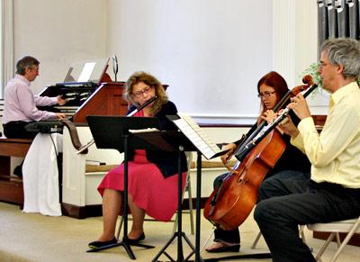 Bach & Forth, seen rehearsing on Friday, includes, from left, Thomas Bohlert, Linda DiMartino Wetherill, Rebecca Perea, Terry Keevil, and (not pictured) Trudy Craney, a soprano.