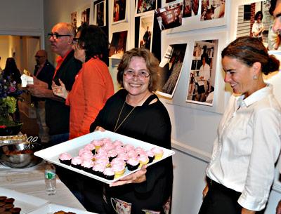 Mary Croghan, center, the owner of East Hampton Business Service, passed out cupcakes during a throw-down at Ashawagh Hall in Springs on Monday to celebrate her business’s 35th anniversary.