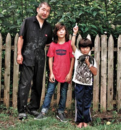 The Jerusalem artichoke flowers hadn’t reached their peak when, from left, Hiroyuki, Cosmo, and Rock Hamada posed for this photo.