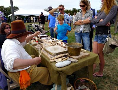 At the well-attended Montauk Archaeology Festival on Saturday, Arthur Kirmss showed a small group a display of wampum and other relics.