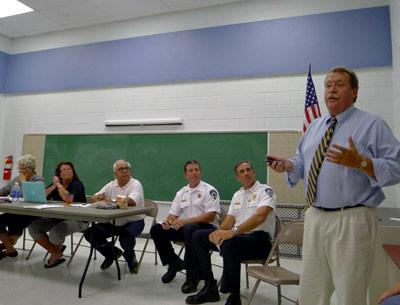 East Hampton Town Police Chief Edward Ecker faced the members of the Montauk Citizens Advisory Committee along with Capt. Mike Sarlo, second from right, and Lt. Chris Hatch during a discussion of traffic hazards on Second House Road.