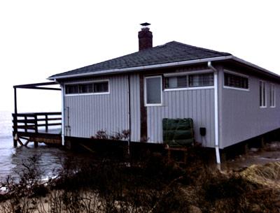 Joshua Young and Christine Lemieux's Mulford Lane house during a storm last winter.