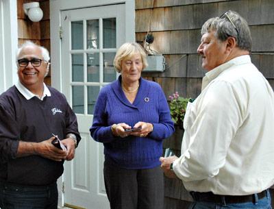 Councilman Dominick Stanzione, left, and Town Clerk Fred Overton chatted with Wibke Sullivan of Church Street, East Hampton, on Oct. 9.