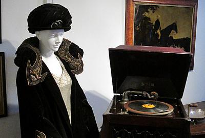 An opera coat from 1918 and a vintage Victrola from “Downton Abbey Style in Southampton: 1900-1920.”