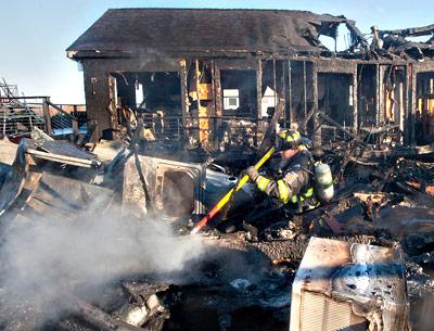 An early-morning fire at the Montauk Shores Condominiums, an oceanfront trailer park on DeForest Road near Ditch Plain, consumed two residences and a shed yesterday.