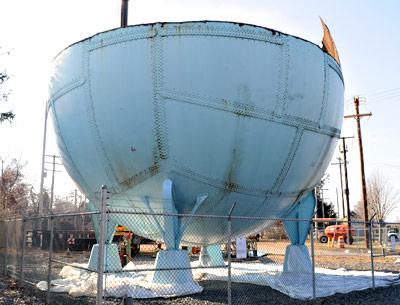 National Grid workers are disassembling a decommissioned gas ball on Railroad Avenue in East Hampton Village.