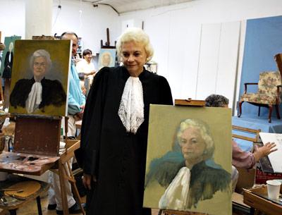 Former Supreme Court Justice Sandra Day O’Connor posed with some of the 25 paintings from Neil Leifer’s film “Portraits of a Lady.