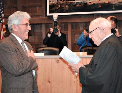 Larry Cantwell, East Hampton Town’s new supervisor, was all smiles while being sworn into office last Thursday by former Town Justice James R. Ketcham.