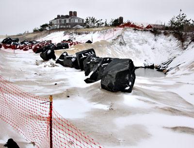 The construction of a rock revetment at Georgica Beach remains in limbo pending resolution of the East Hampton Town Trustees’ lawsuit against Mollie Zweig.