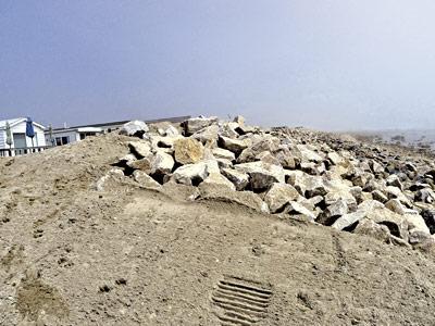 Settlement negotiations are underway between the Department of Environmental Conservation and Montauk Shores Condominiums over a rock revetment the state said was improperly installed last year.