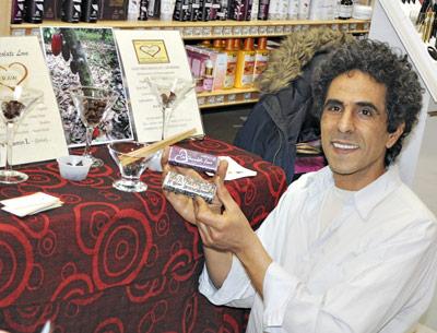 Shimon Pinhas, the founder and C.E.O. of Raw Chocolate Love Corp, served samples of his high-grade chocolate products at Provisions in Sag Harbor over the weekend during the village’s HarborFrost celebration.