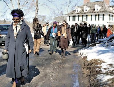 Sandra Arnold led the singing of spirituals during a “walk of remembrance” to the slave burial ground at Sylvester Manor on Saturday morning. She was among those who spoke following a screening of “Traces of the Trade: A Story From the Deep North” at the Shelter Island Library the previous night.