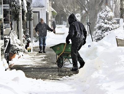 People dug out from a January snowstorm, the first of many they would face down this year.