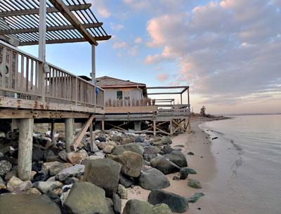 Flood-prone properties on Lazy Point, like these along the bay at the ends of Mulford Lane and Bayview Avenue, could be eligible for buyouts under a federal grant.