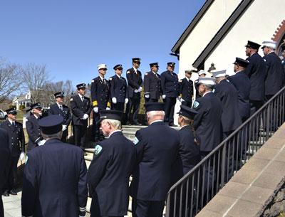 Members of the Montauk Fire Department lined the stairs to St. Therese of Lisieux Catholic Church Sunday during an ecumenical memorial service that is the first of many 75th anniversary events planned this year.