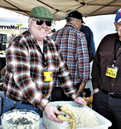 Tom O’Neill offered tastings and demonstrations of how the root is ground and then pureed with vinegar to create the familiar mixture.