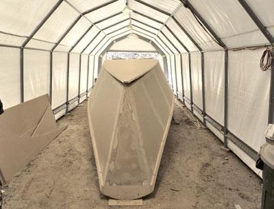 Sheltered under a temporary structure in Amagansett, Dwayne Denton has been building a plywood dory on traditional lines for Dan and Paul Lester, brothers who are commercial fishermen.