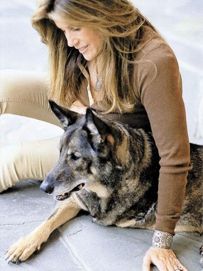 Jill Rappaport, seated with a furry friend, is the host of the Travels With Charley dog walk in Sag Harbor, based on John Steinbeck’s book and sponsored by the Bay Street Theatre.