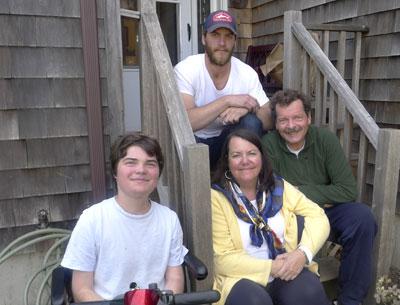 The Lightcap family, Terence Lightcap (in chair) Grace, Ed, and Dustin (on stairs) will hold a yard sale on Memorial Day weekend to raise money for research into drugs that could help Terence, who has Duchenne muscular dystrophy.