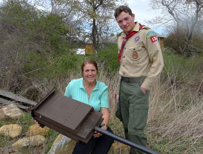 With the help of his fellow Boy Scouts in Troop 136, Richard Malik Atkinson completed the last stage of his Eagle Scout qualifications by building 20 bat houses like the one held by his mother, Dorothy Malik Atkinson.