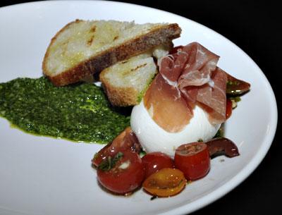 Fresh mozzarella, prosciutto, tomatoes, and pesto