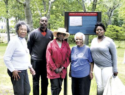 Celebrating good news for the St. David A.M.E. Zion Cemetery were, from left, Kathleen Tucker, the Eastville Community Historical Society’s historian; Gary Cole, whose great-grandmother was buried there; Gloria Primm Brown; Eunice Jackie Vaughan, the society’s president, and Georgette Grier-Key, the society’s director.