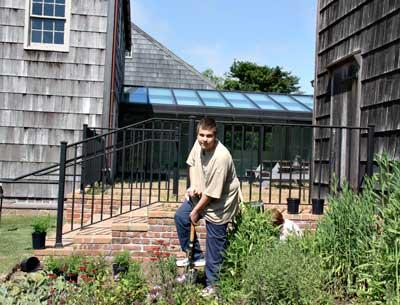 Matt Lester, a Life Scout working toward becoming an Eagle Scout, helped members of the Garden Club of East Hampton install a butterfly garden at East Hampton Town Hall Monday.